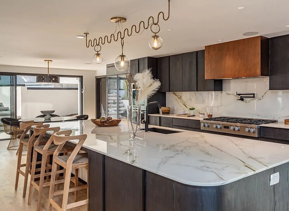 Sunset Plaza Vantage — kitchen with marble island and bar seating