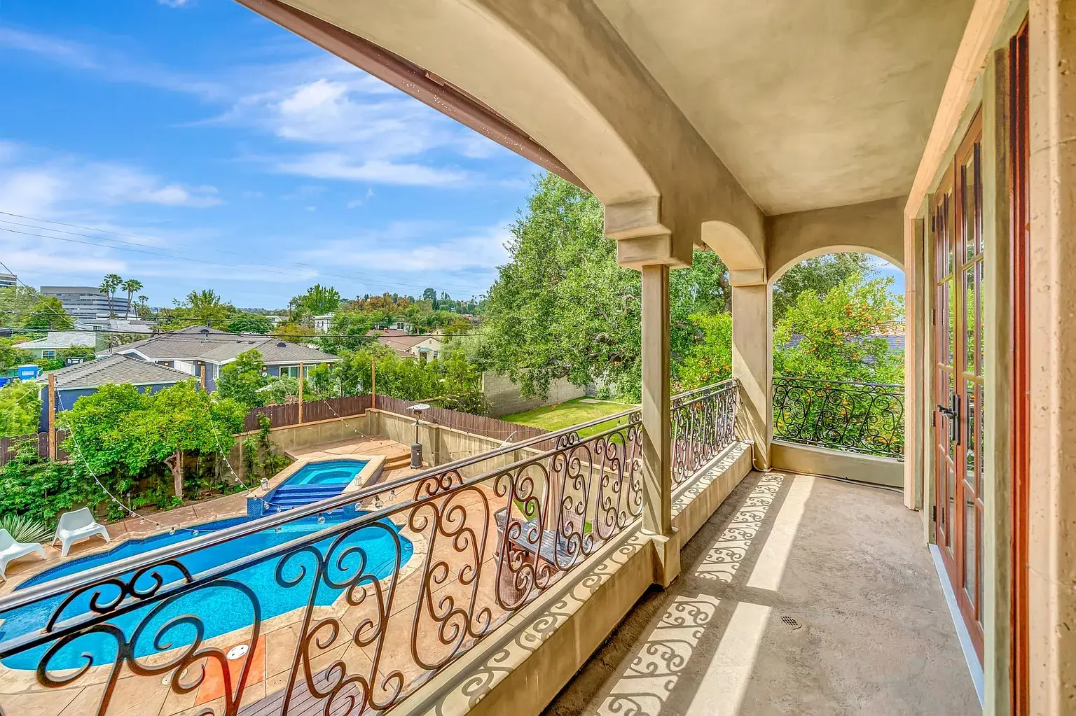 Addison Portico — balcony view over the pool and valley