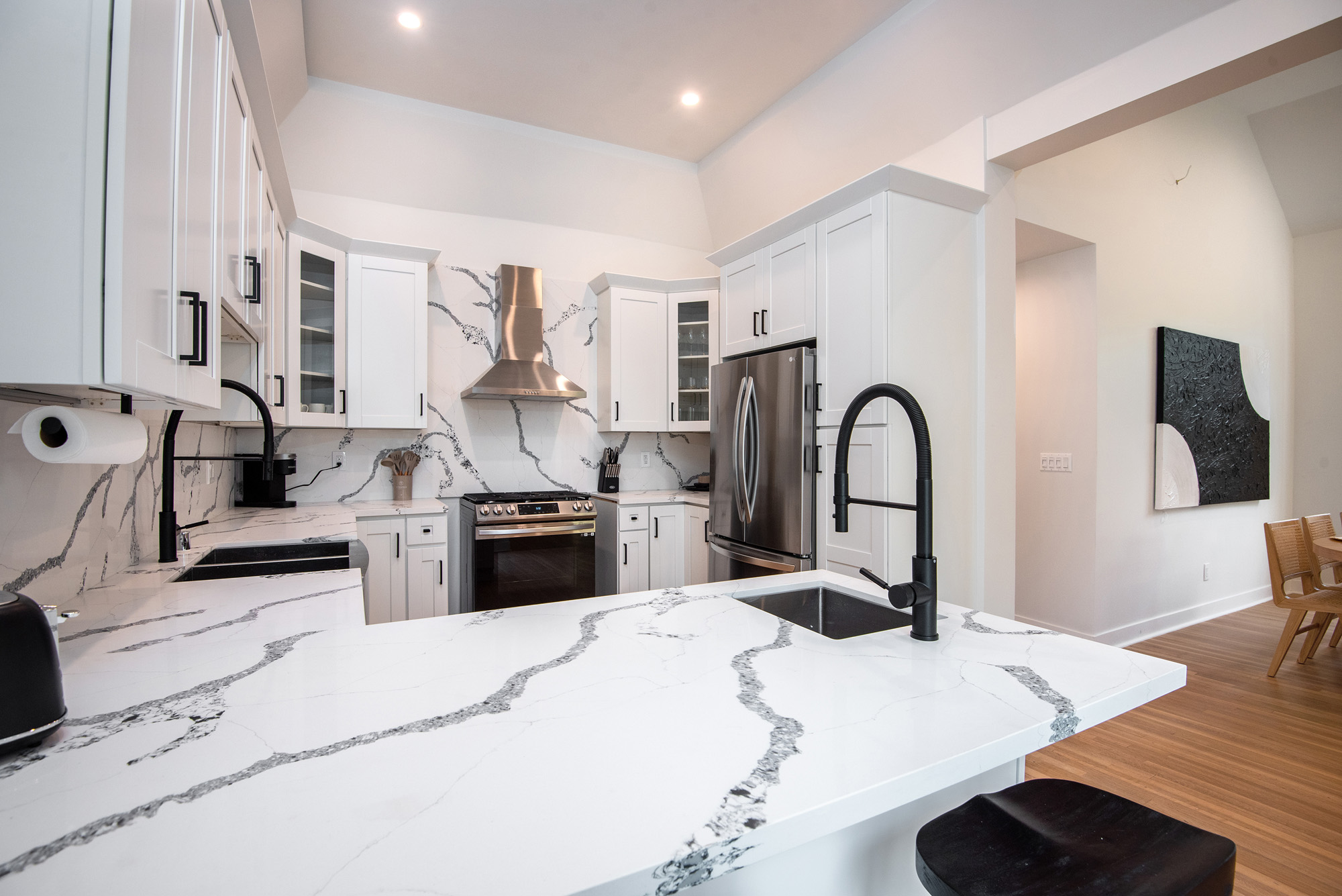 Alta Vista Terrace — kitchen with marble island and range hood