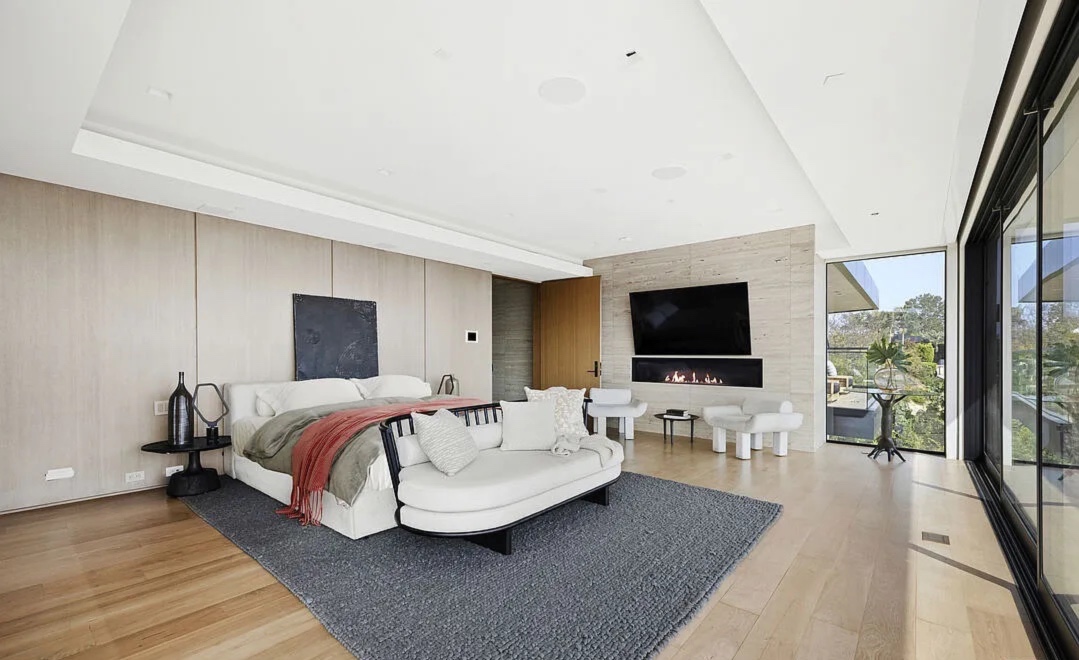Summitridge Heights — bedroom with media wall and city view