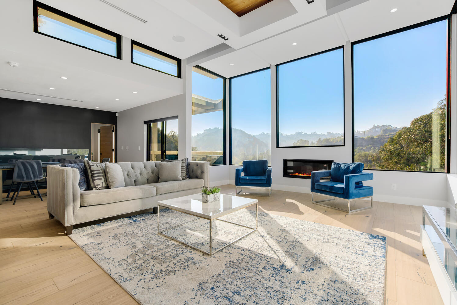 Thames Canyon House — living room with fireplace and canyon window