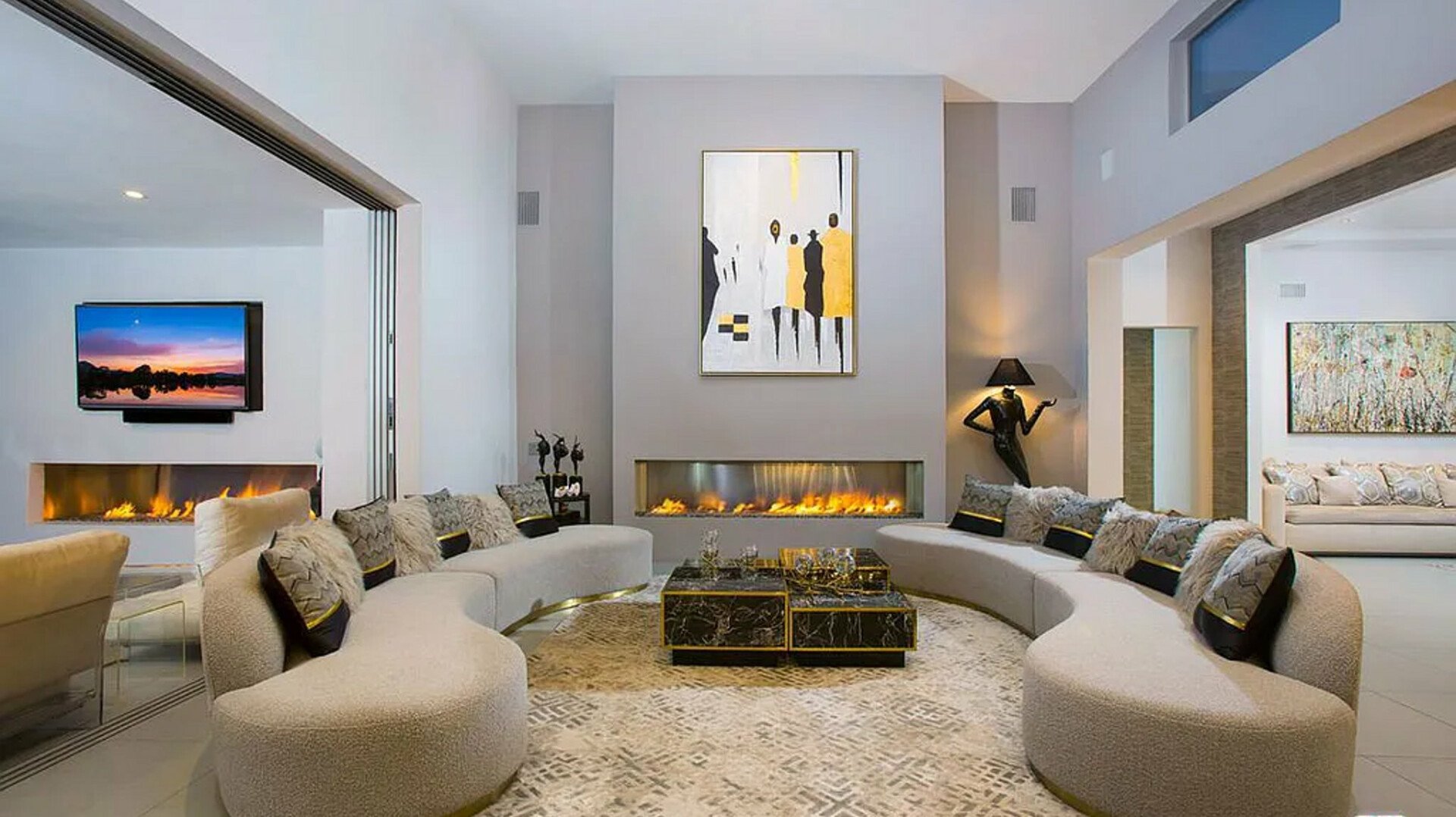 Ellison Ridgehouse — living room with curved sofa and linear fireplace