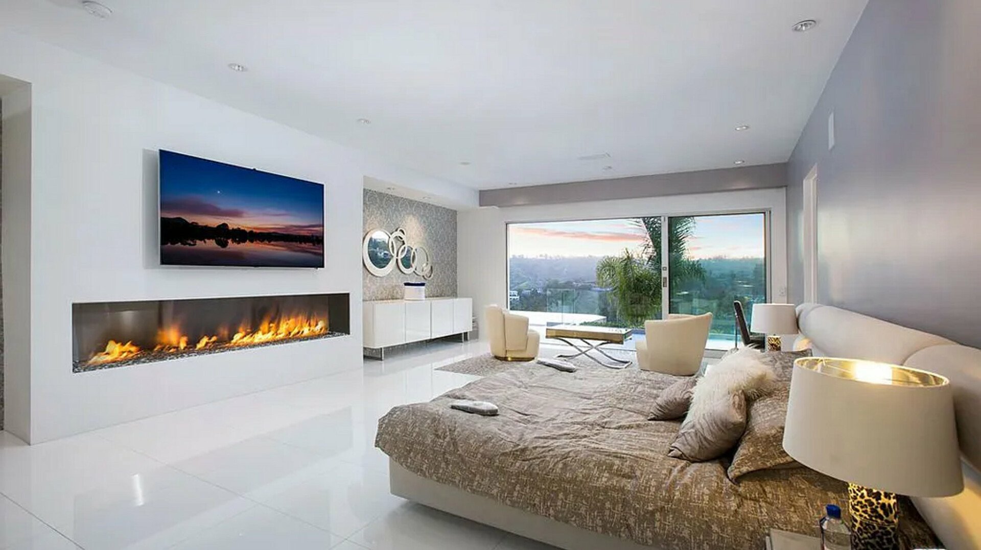 Ellison Ridgehouse — bedroom with linear fireplace and canyon view