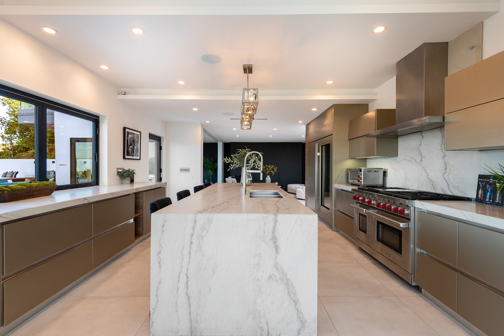 Gayle Quinta — kitchen with marble island and range