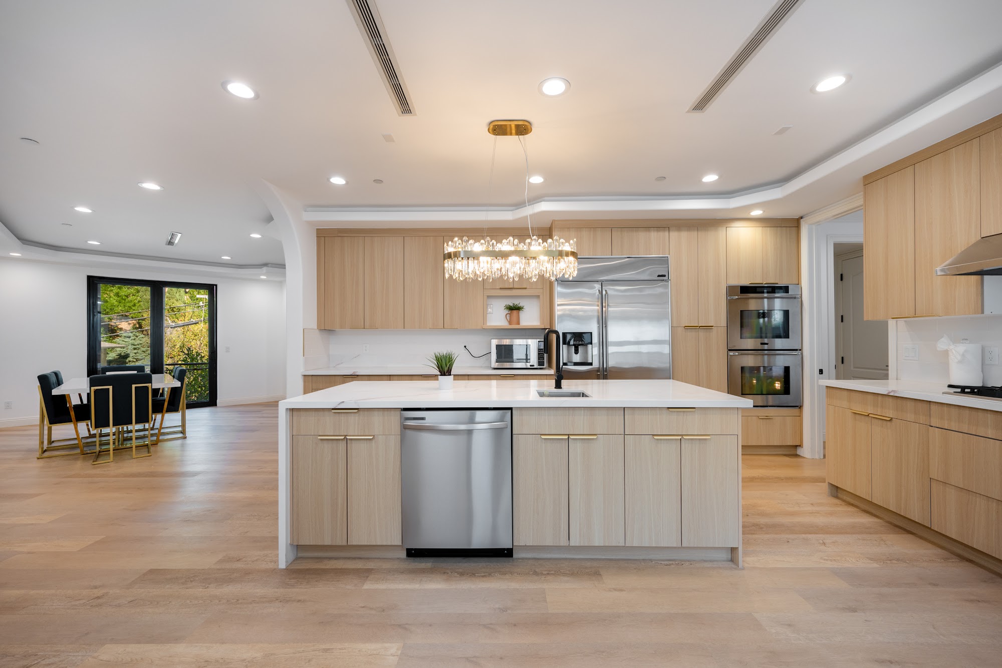 Grimes Olive House — kitchen with island and dining beyond