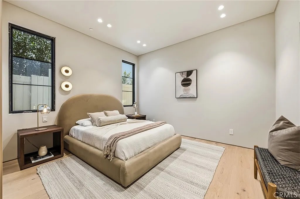 Valjean Hacienda — bedroom with arched headboard