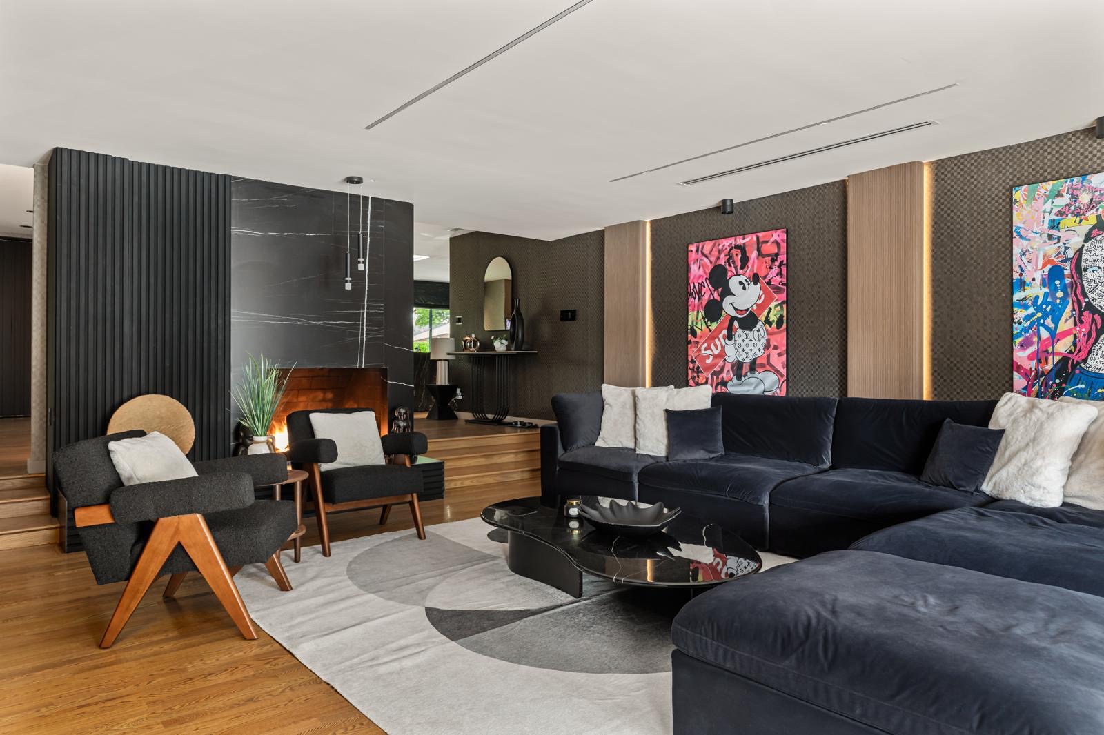 Varna Garden House — living room with sectional and artwork
