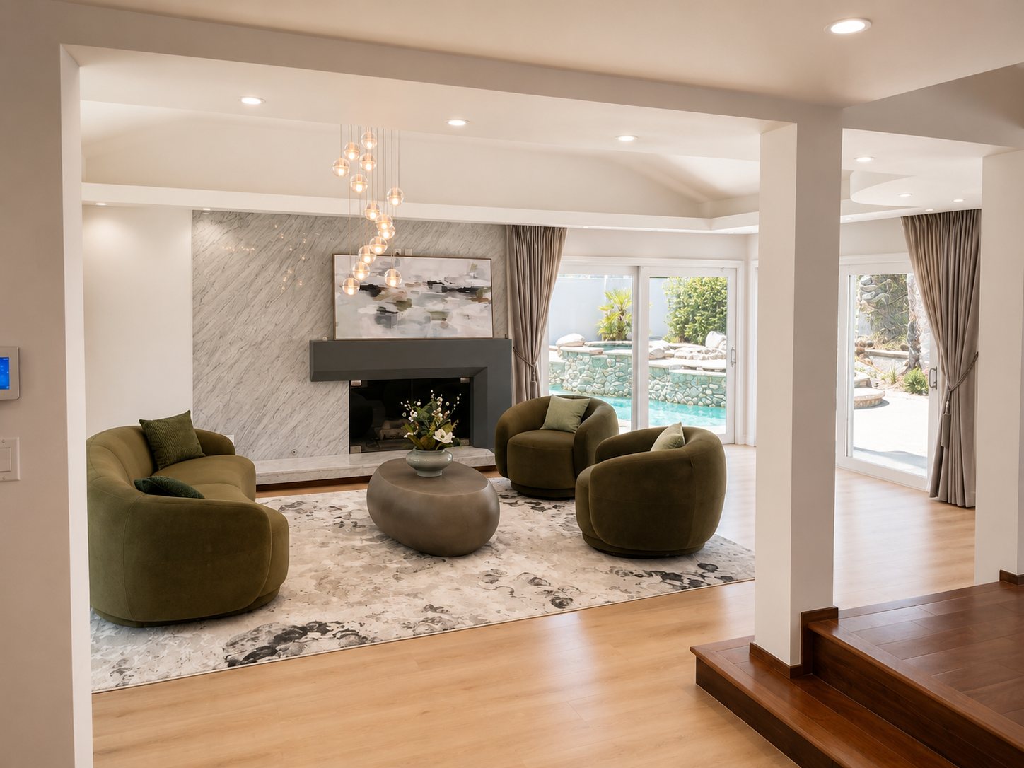 Electra Overlook — living room with a fireplace and sculptural seating